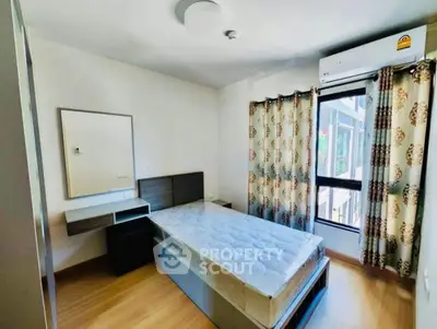 Cozy bedroom with modern furnishings and natural light