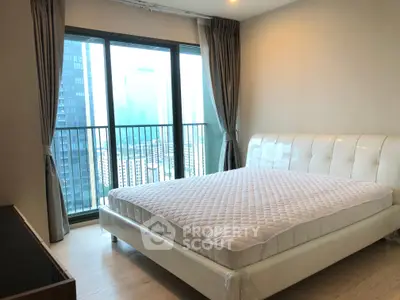 Modern bedroom with city view and elegant decor in high-rise apartment