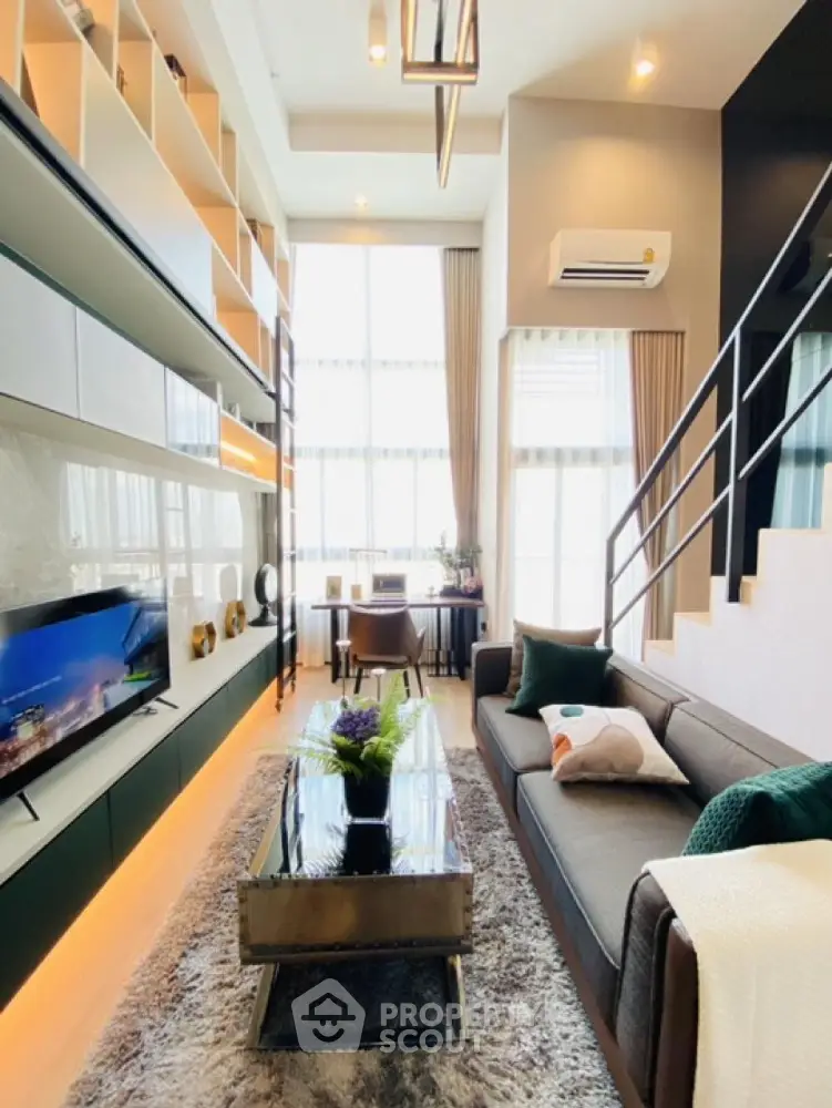 Modern duplex living room with high ceilings and stylish decor