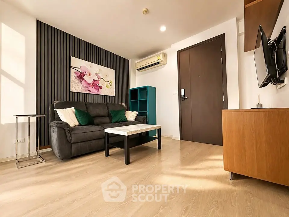 Modern living room with stylish decor and air conditioning in a cozy apartment.