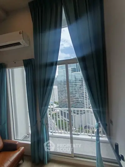 Stunning high-rise apartment with floor-to-ceiling windows and city view