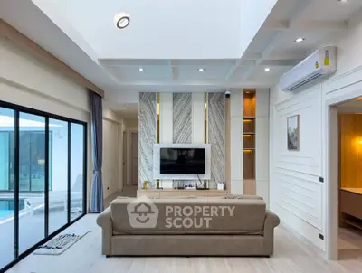 Modern living room with stylish decor and poolside view
