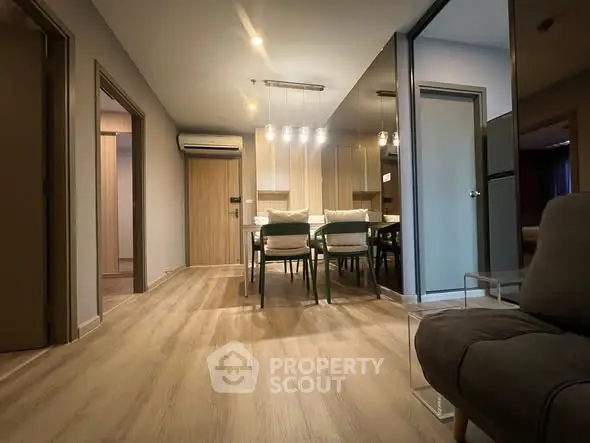 Modern apartment interior with stylish dining area and cozy ambiance.