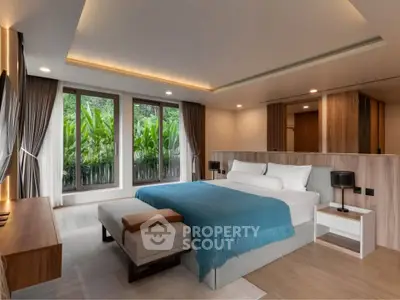 Luxurious modern bedroom with large windows and garden view, featuring elegant decor and ambient lighting.