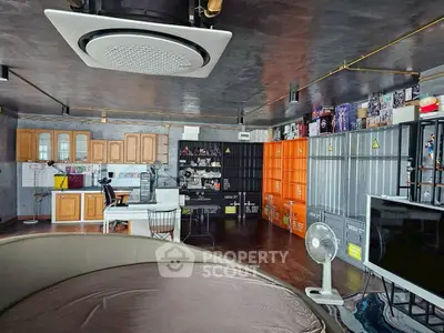 Stylish industrial-style living room with modern decor and unique storage solutions.