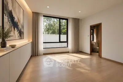 Spacious modern living room with large window and elegant decor