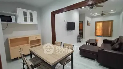 Spacious living and dining area with modern furniture and open layout