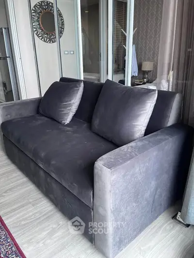 Modern living room with stylish gray sofa and elegant decor