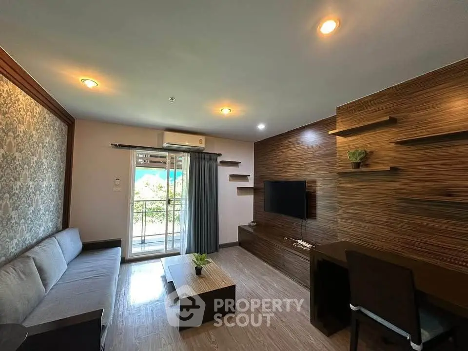 Modern living room with stylish decor and balcony view