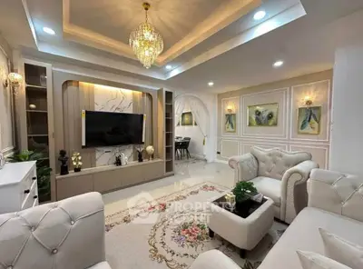 Luxurious living room with elegant chandelier and plush seating