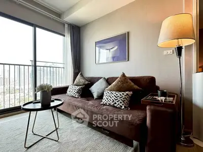 Stylish living room with city view, modern sofa, and elegant decor.