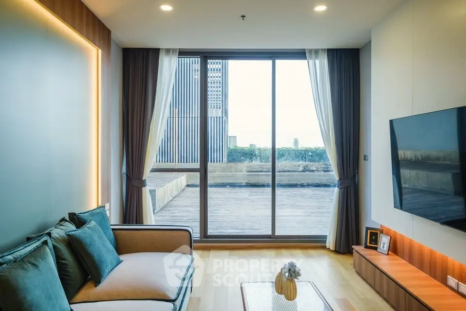 Modern living room with large windows and stylish decor overlooking a cityscape.