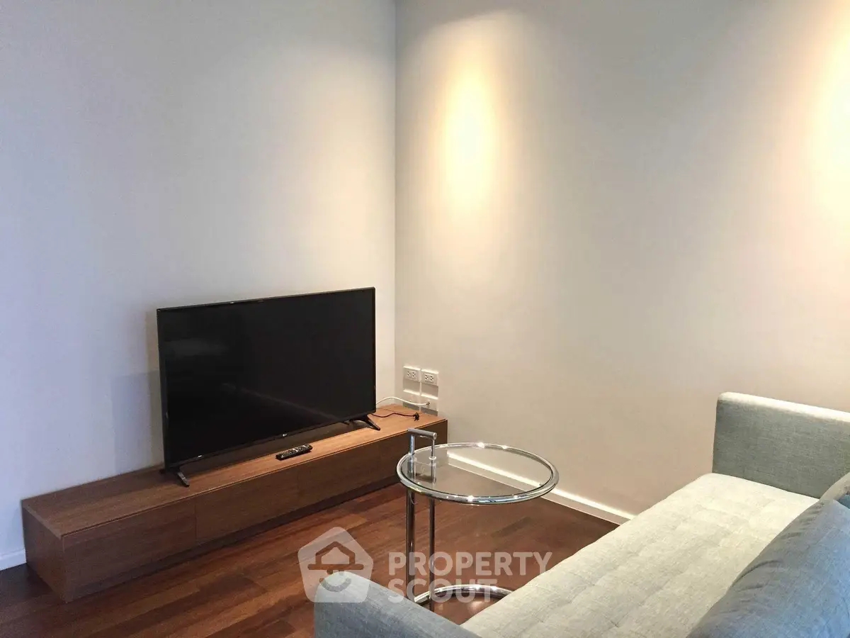 Modern living room with sleek TV setup and stylish furniture