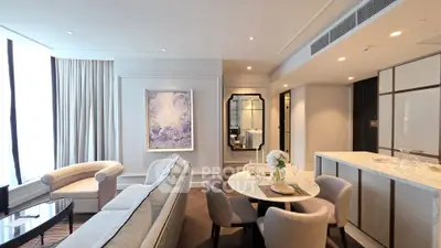 Luxurious living room with elegant decor and dining area in modern apartment.
