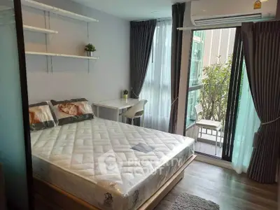 Modern bedroom with balcony access and stylish decor