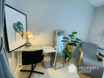 Modern study room with sleek desk, stylish chair, and lush indoor plants