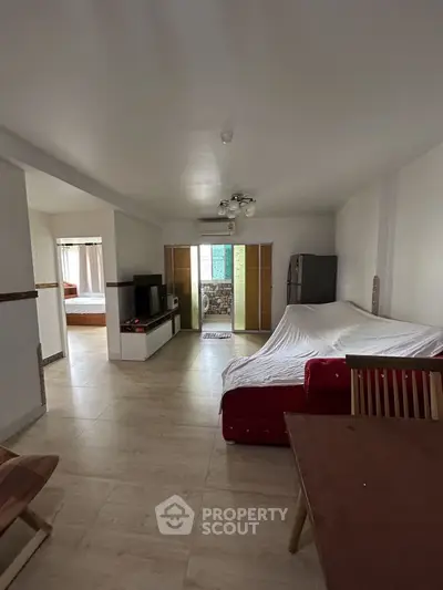 Spacious living room with modern decor and open layout, perfect for family gatherings.