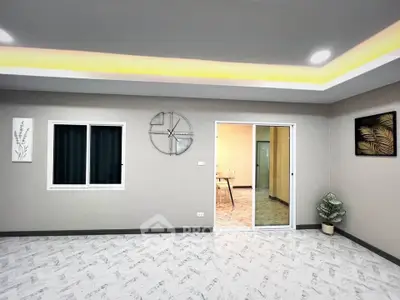 Modern living room with stylish decor and sliding glass door