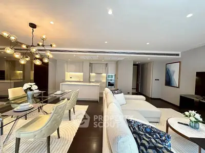 Luxurious open-plan living room with modern decor and elegant lighting