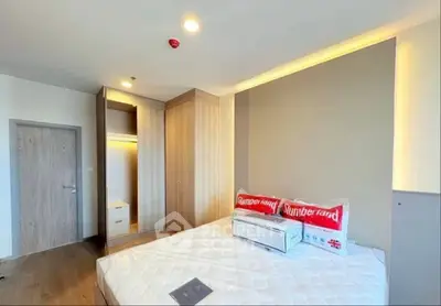 Modern bedroom with stylish decor and ample natural light