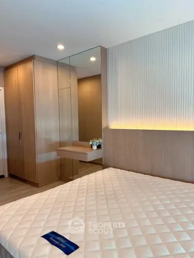 Modern bedroom with elegant wood paneling and cozy lighting