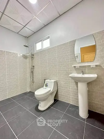 Modern bathroom with sleek fixtures and stylish tile design.