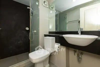 Modern bathroom with glass shower and sleek fixtures