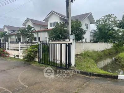 Charming suburban house with lush greenery and modern design, perfect for family living.