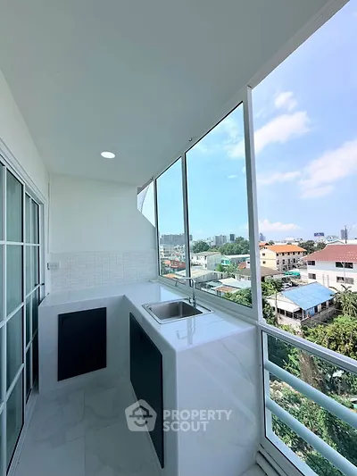 Modern balcony with sleek design and stunning city view, perfect for relaxation and entertaining.