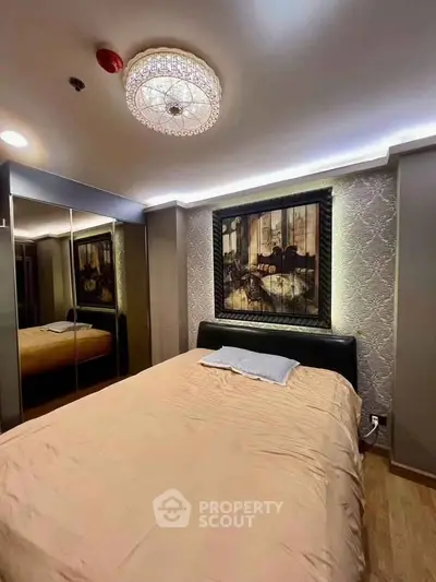 Luxurious bedroom with elegant decor and mirrored wardrobe