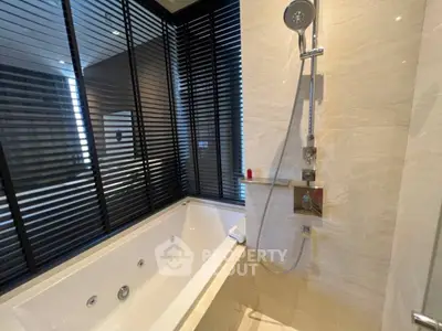 Luxurious bathroom with modern bathtub and sleek shower design