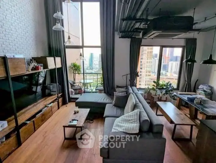 Spacious modern living room with city view and stylish decor