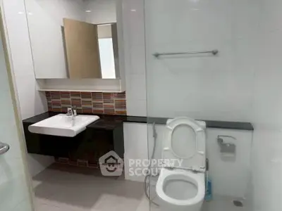 Modern bathroom with sleek fixtures and stylish tile accents