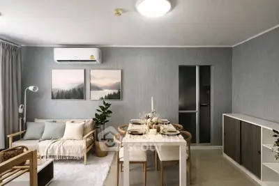 Modern living room with dining area, stylish decor, and air conditioning