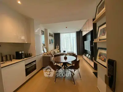 Modern open-plan living room with kitchen, stylish decor, and city view.