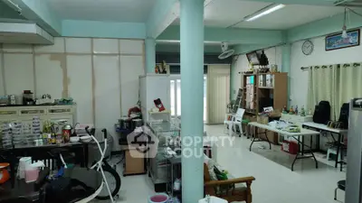 Spacious living area with eclectic decor and ample natural light, perfect for creative customization.