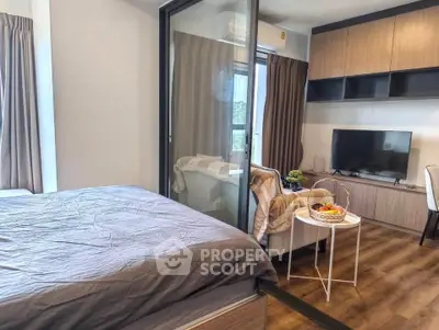 Modern studio apartment with cozy living area and stylish decor