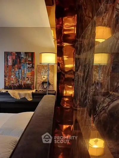 Luxurious bedroom with artistic decor and warm lighting