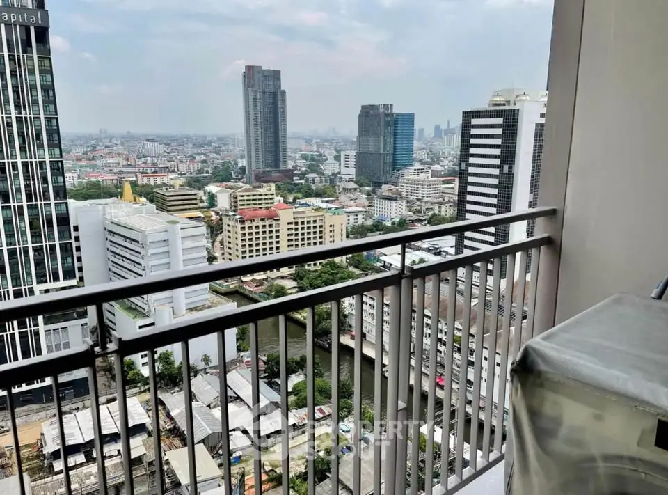 Stunning cityscape view from high-rise balcony overlooking urban skyline.