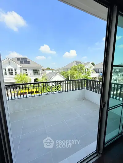 Spacious balcony with scenic view of modern residential neighborhood