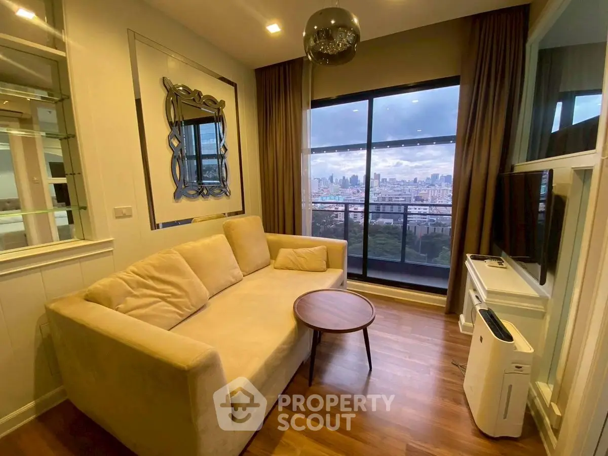Cozy living room with city view, modern decor, and large window.