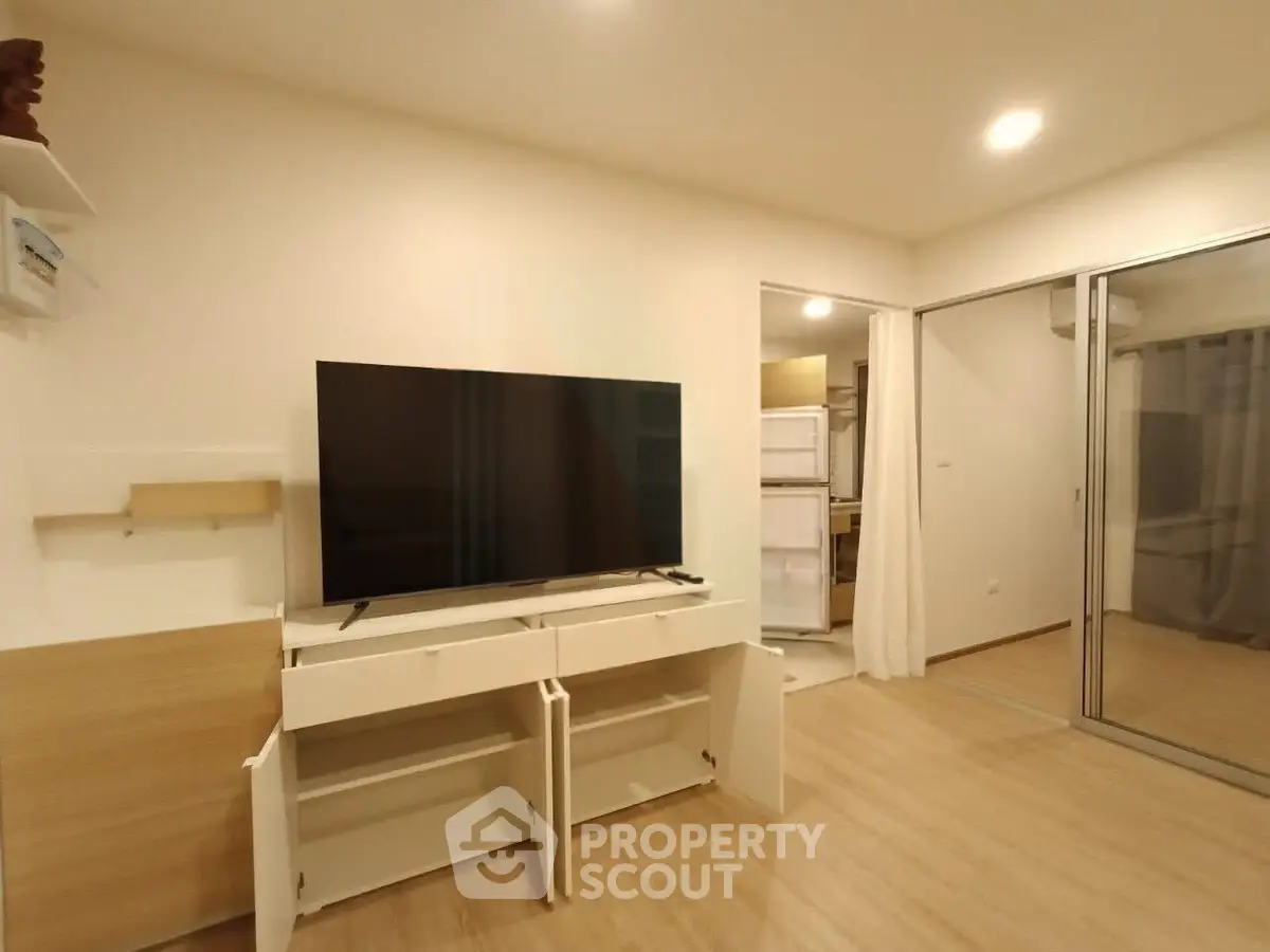 Modern living room with sleek TV setup and open layout design