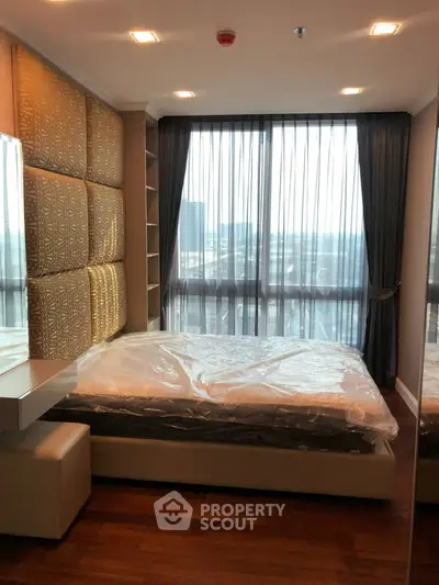 Luxurious bedroom with floor-to-ceiling windows and elegant decor