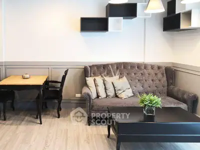 Chic living room with stylish sofa and modern decor in elegant apartment.