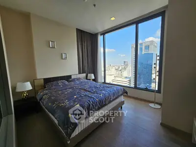 Luxurious bedroom with stunning city view and modern decor