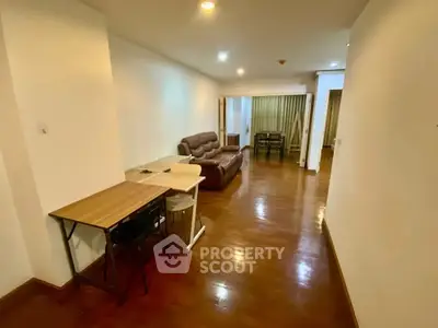 Spacious living room with wooden flooring and cozy seating area