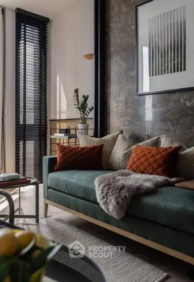 Stylish living room with modern decor, plush sofa, and natural light for a cozy ambiance.