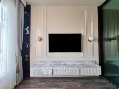 Elegant living room with modern TV setup and stylish decor