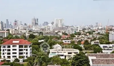 Stunning cityscape view showcasing urban skyline and lush greenery, perfect for real estate investment.