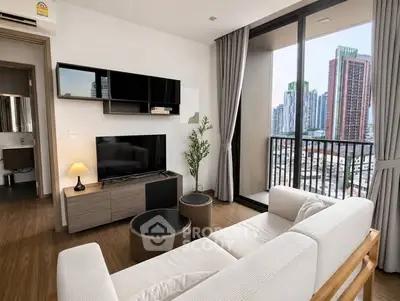 Modern living room with city view, stylish furniture, and large windows in a high-rise apartment.